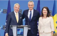  ?? ?? Finland's FM Pekka Haavisto (l), his Swedish counterpar­t Ann Linde (r), and NATO chief Jens Stoltenber­g at a media conference after the signature of the NATO Accession Protocols for Finland and Sweden in Brussels on July 5, 2022.