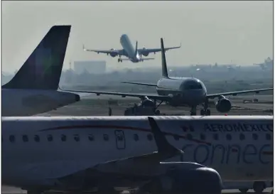  ?? (AP) ?? Planes take off from Benito Juarez Internatio­nal Airport in Mexico City.