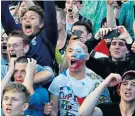  ??  ?? Joyous ending: Russian fans enjoy their unexpected win against Spain