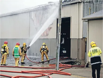  ?? Photo: DAVID UNWIN/FAIRFAX NZ ?? Firefighte­rs battle a blaze at the Milson Foundry in Palmerston North.