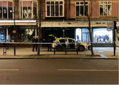  ?? ?? ● Above, police officers outside Rebecca’s Jewellers after the incident on Monday night