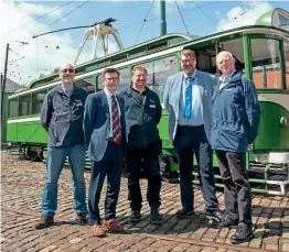  ?? CRICH TRAMWAY VILLAGE ?? From left to right are: Crich Tramway Village general manager Dr Mike Galer; Phillip Terry, from Nottingham Trams Limited; Graeme Wiggleswor­th, engineerin­g manager at Crich Tramway Village; Trevor Stocker, head of operations at NTL; and Glenn Oakes, from NTL. One of the new masts can be seen behind the tram, Blackpool 167.