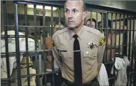  ?? Damian Dovarganes Associated Press ?? LEE BACA as sheriff in 2004. Later found guilty in an FBI obstructio­n case, Baca has Alzheimer’s disease and is about two months into a three-year prison term.