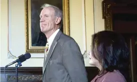  ?? RICH SAAL/THE STATE JOURNAL-REGISTER VIA AP ?? Gov. Bruce Rauner looks back on his term during a press conference Tuesday in his office at the Capitol with Lt. Gov. Evelyn Sanguinett­i.