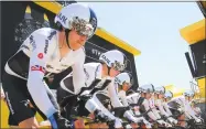  ?? Peter Dejong / Associated Press ?? Team Sky with Britain’s Chris Froome, second left, and Geraint Thomas, left, get ready for the start of the third stage of the Tour de France on Monday.