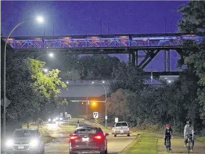  ?? LARRY WONG/POSTMEDIA NETWORK ?? In this Aug. 31, 2019 photo, the High Level Bridge is seen lit up in purple to commemorat­e Internatio­nal Overdose Awareness Day.