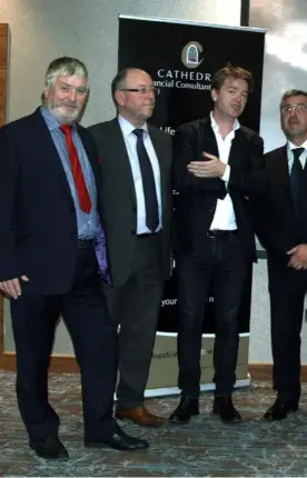  ??  ?? Brexit debate: Economist David McWilliams was the guest speaker at a Dundalk last week. Pictured with Mr McWilliams (centre) are Cathedral John McDonnell and Barry Oliver.