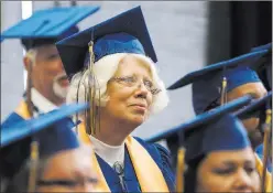  ??  ?? Cheryl Spargo, a Walmart personnel coordinato­r, listens during the Las Vegas Training Academy’s graduation ceremony on Tuesday.