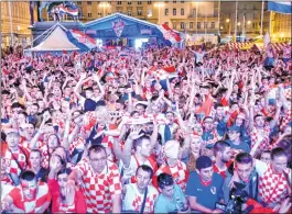  ??  ?? Croatia's supporters celebrate at the main square in Zagreb.