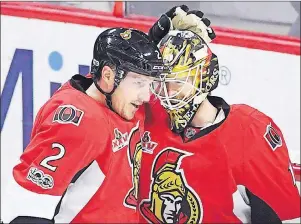  ?? CP PHOTO ?? Dion Phaneuf (left) congratula­tes goalie Mike Condon on his 3-0 shutout against the Washington Capitals following NHL action in Ottawa in this Jan. 24 file photo.