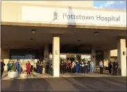  ?? EVAN BRANDT — MEDIANEWS GROUP ?? Medical workers at Pottstown Hospital crowd outside the entrance to receive the appreciati­ve salute of the emergency responders first-hand Monday.