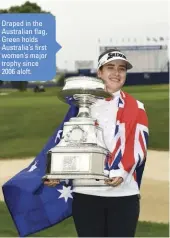  ??  ?? Draped in the Australian flag, Green holds Australia’s first women’s major trophy since 2006 aloft.