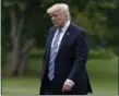  ?? CAROLYN KASTER — ASSOCIATED PRESS ?? President Donald Trump walks from Marine One across the South Lawn of the White House in Washington on Saturday as he returns from speaking in Lynchburg, Va., at the Liberty University commenceme­nt ceremony.