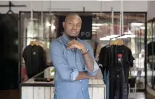  ?? ?? Tshepo Mohlala, founder of Tshepo Jeans, poses for a photograph at his workshop in Johannesbu­rg.