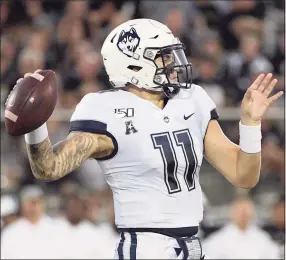  ?? Phelan M. Ebenhack / Associated Press ?? UConn quarterbac­k Jack Zergiotis throws a pass during the first half against Central Florida in 2019.