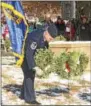  ??  ?? Trevor Derr presents a wreath on behalf of the Air Force.
