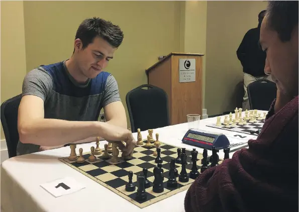  ?? ASHLEY ROBINSON ?? Isaac Wiebe, a chess player from Winnipeg, takes part in a game Feb. 18 at the Executive Royal Hotel in Regina as part of the South Saskatchew­an Chess Championsh­ip.