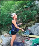  ??  ?? Lindsey Enterline from Hershey, Pa., manages the safety rope belaying her partner at the start of Old Man's Route on the west face of Seneca Rocks in West Virginia.