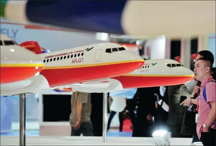  ?? XINHUA ?? The booth of Commercial Aircraft Corp of China Ltd at an industry expo held in Singapore.