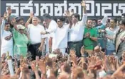  ?? REUTERS ?? Ranil Wickremesi­nghe (3rd left) waves at his supporters.