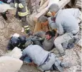  ?? — Reuters ?? A man is rescued alive from the rubble in Amatrice, central Italy on Wednesday.