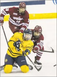  ?? John Vanacore /For Hearst Connecticu­t Media ?? Quinnipiac’s Joe O'Connor battles to clear the puck against UMass on Friday.