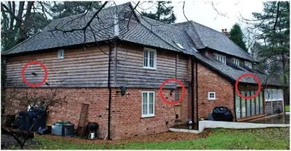  ??  ?? High security: Mr Steele’s £1.5m home in Farnham, Surrey, bristles with CCTV cameras (circled)