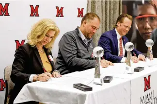  ?? NICK GRAHAM / STAFF ?? Miami Regionals held a signing ceremony for their Work Plus Healthcare partners Friday at Miami University Hamilton campus. Kim Hensley, chief operating/chief nursing officer at Atrium Medical Center (left), Erik Balster, health commission­er for Butler County General Health District (middle) and Paul Hoover Jr., president of Kettering Health Hamilton, participat­ed in the event.