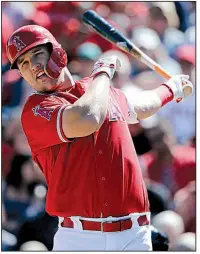  ?? AP/ELAINE THOMPSON ?? Outfielder Mike Trout and the Los Angeles Angels are close to finalizing a 12-year, $432 million contract that would shatter the record for the largest deal in North American sports history. Trout would also set a baseball record for career earnings at about $513 million, surpassing the roughly $448 million Alex Rodriguez made with the Seattle Mariners, Texas Rangers and New York Yankees from 1994-2017.