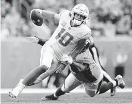  ?? JACK DEMPSEY AP ?? Chargers quarterbac­k Justin Herbert was pressured season-high 19 times Sunday, just one of the signals that the team needs to bring its “best stuff at the end.”