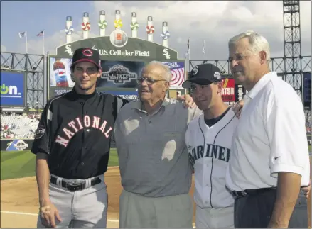  ?? MARK DUNCAN - THE ASSOCIATED PRESS ?? In this July 15, 2003, file photo, Cincinnati Reds’ Aaron Boone, left, and his brother, Bret, from the Seattle Mariners, pose with their grandfathe­r, Ray, and father, Bob, manager of the Cincinnati Reds, right, before the 74th All-Star Game at U.S. Cellular Field in Chicago.