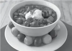  ?? Tribune News Service ?? ■ Cherry and chipotle pepper turkey chili, topped with plain yogurt.