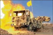  ?? SYRIAN CENTRAL MILITARY MEDIA VIA AP ?? A Hezbollah truck-mounted artillery piece blasts militant positions on the Lebanon-Syria border. The Syrian army and Lebanon’s Hezbollah launched the offensive Friday to remove militants.