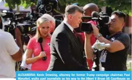  ??  ?? ALEXANDRIA: Kevin Downing, attorney for former Trump campaign chairman Paul Manafort, walks past journalist­s on his way to the Albert V Bryan US Courthouse on the seventh day of Manafort’s trial. — AFP