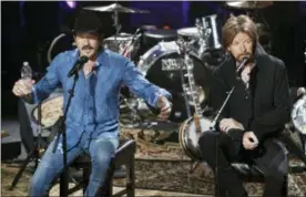  ?? MARK HUMPHREY — THE ASSOCIATED PRESS ?? In this file photo, Kix Brooks, left, and Ronnie Dunn of the country music duo Brooks &amp; Dunn, talk about their decision to stop performing together as they answer questions from the audience during a television taping in Nashville, Tenn.