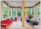  ?? ?? Attributes of the sunroom include three walls of floorto-ceiling windows that provide views of the backyard.