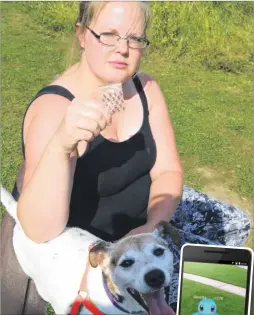  ?? Picture: John Westhrop FM4467495 ?? Lorraine Otway, with her dog Charlie, holding up an empty packet she suspects contained some sort of drug at Allington’s Millennium Green, where she says the Pokémon Go craze has led to more antisocial behaviour