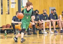  ??  ?? Andrew Pineo searches for a safe pass as he pushes the ball into Middleton’s defensive zone.