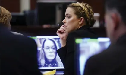  ?? Photograph: Shawn Thew/AP ?? Amber Heard sits in the courtroom as her former personal assistant Kate James testifies via video in Fairfax, Virginia, on Thursday.