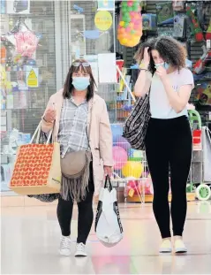  ??  ?? New normal Shoppers are required to wear masks