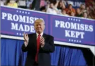  ?? CAROLYN KASTER — THE ASSOCIATED PRESS ?? President Donald Trump arrives to speak at the Pennsylvan­ia Farm Show Complex and Expo Center in Harrisburg on Saturday, the 100th day of his presidency.