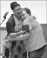  ??  ?? PATHWAYS: National Park College Career Pathways Initiative Director LaTaschya Harris, left, presented the Career Pathways student of the year award to Sarah Prince during the program’s graduation reception May 12 in the Dr. Martin Eisele Auditorium of the Frederick M. Dierks Center for Nursing and Health Sciences.