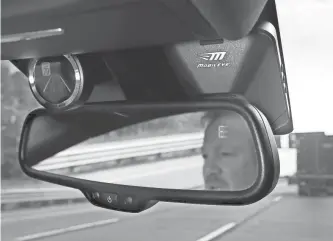  ?? ASSOCIATED PRESS ?? A Mobileye camera system, mounted behind the rearview mirror, can monitor speed limits and warn drivers of potential collisions. The system can be added to older cars.