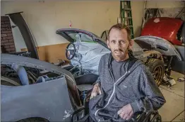  ?? Bobby Block/The Signal ?? Craig Bennett intends to pass down the Miata in his garage to his daughter, Paige. After being diagnosed with cancer, Bennett created a custom wrap for his son — a tradition he now hopes to continue for his daughter despite being placed into hospice care.