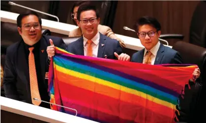  ?? Photograph: Rungroj Yongrit/EPA ?? Thai lawmakers inside parliament celebrate the passing of the marriage equality bill.