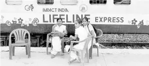  ?? — AFP photo ?? Nurses sit outside the Lifeline Express at a railway station in Jalore in India’s western state of Rajasthan.