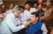  ?? PTI ?? BJP leader Devendra Fadnavis celebrate with other leader during a party meeting, at Taj President Hotel in Mumbai