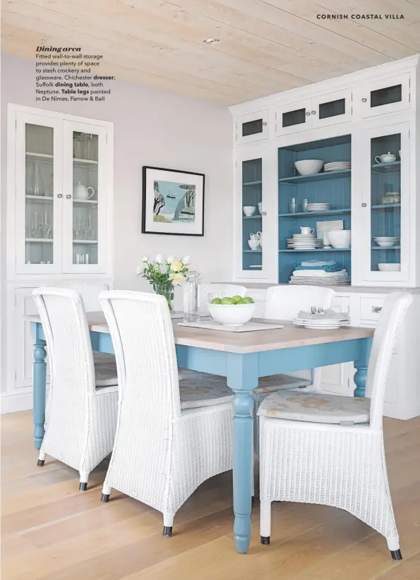  ??  ?? Dining area
Fitted wall-to-wall storage provides plenty of space to stash crockery and glassware. Chichester dresser;
Suffolk dining table, both Neptune. Table legs painted in De Nimes, Farrow & Ball