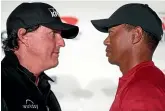  ??  ?? Phil Mickelson and Tiger Woods face off in Las Vegas ahead of ‘‘The Match’’.