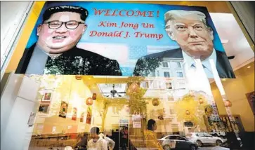  ?? Luong Thai Linh EPA/Shuttersto­ck ?? A POSTER heralding the second summit between the U.S. and North Korea dominates a restaurant in Hanoi.